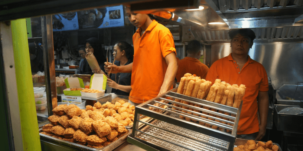 Street food vendor cooking pad thai