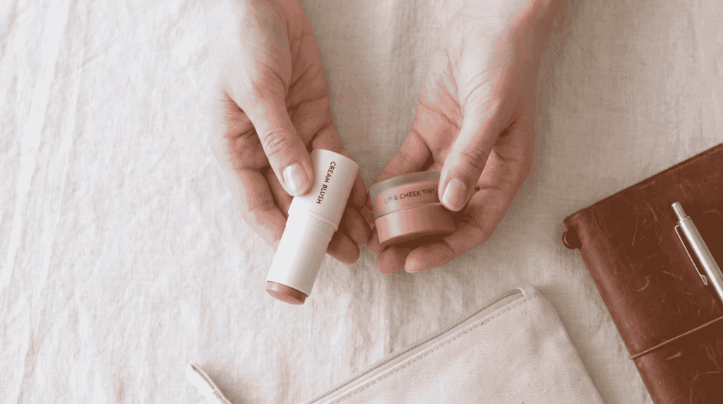 backpacker influencer showing multi-use makeup products for minimalist backpacking kit
