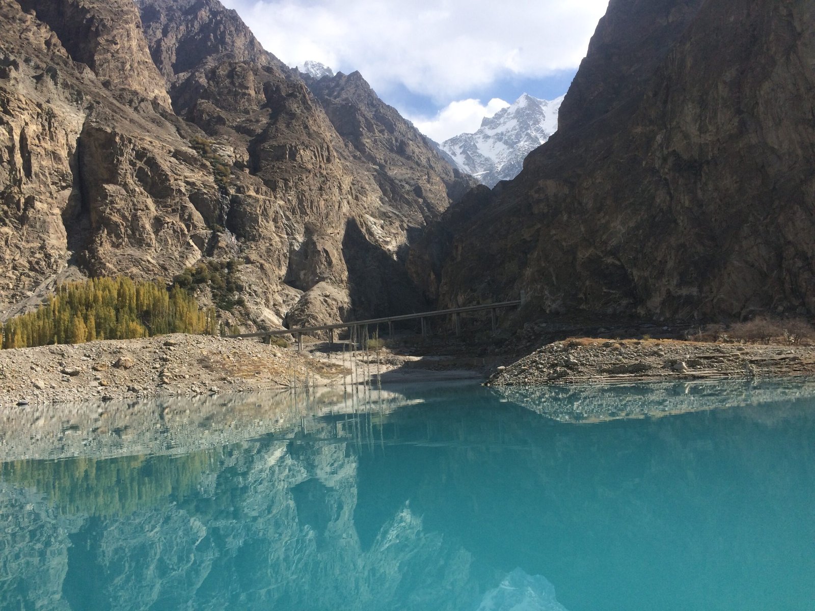 Turquoise water of Attabad Lake with the Karakoram Highway road in Gojal