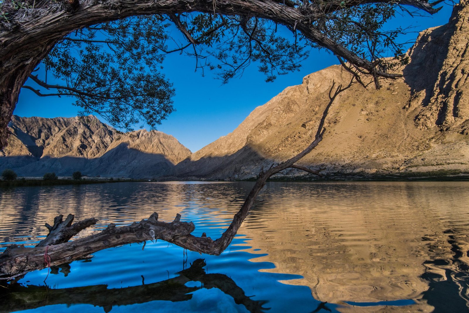 Still waters of Blind Lake (Jarba Zhou) between mountains in Shigar Valley