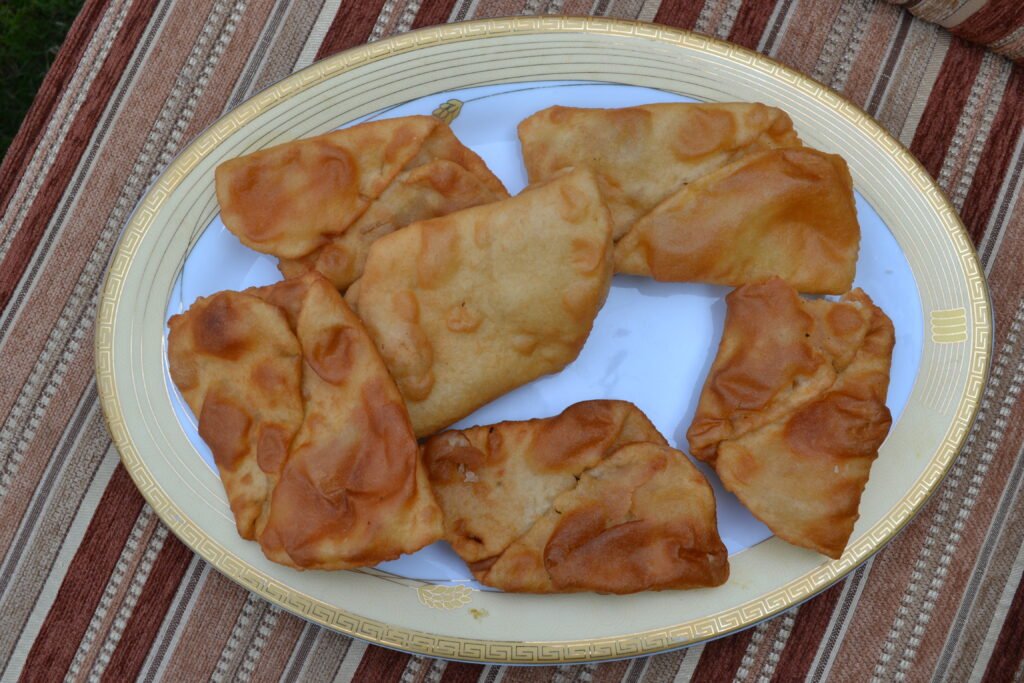 Arzauk, a traditional deep-fried bread from Hunza Valley, served on a plate