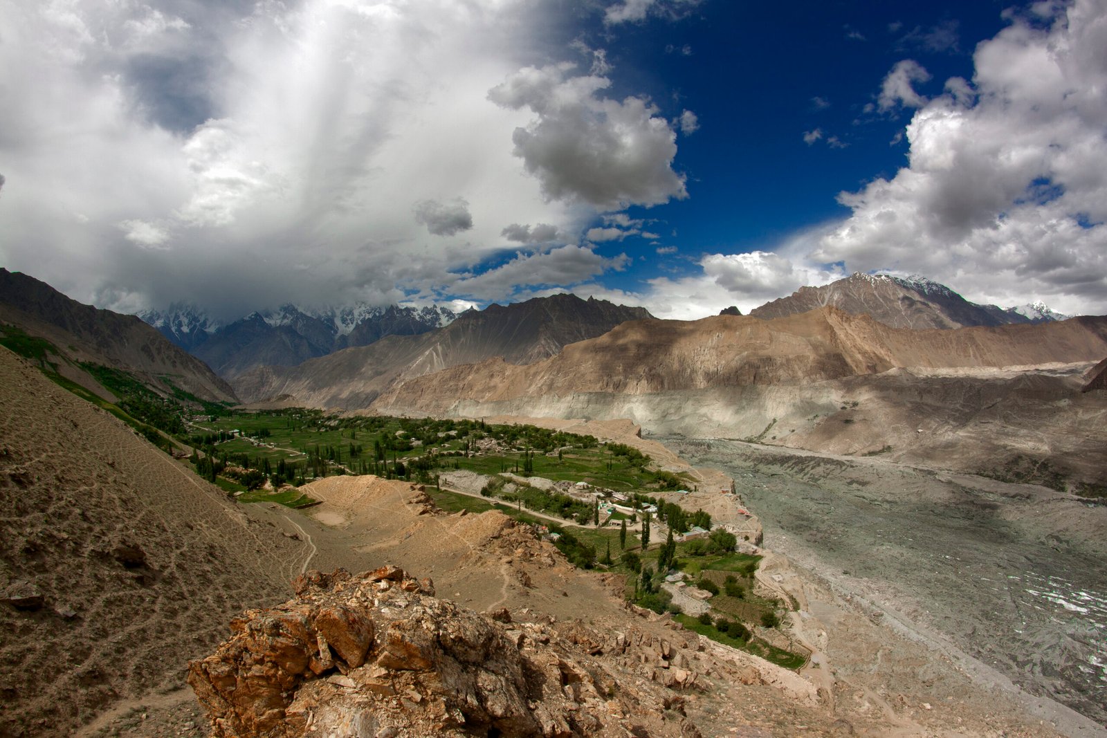 Green terraces and village houses in Hoper Valley, Nagar District.