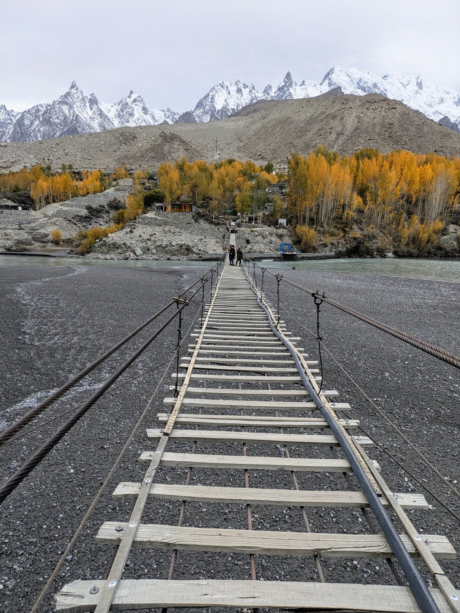 Wooden planks of the Hussaini Suspension Bridge over the Hunza River in Gojal