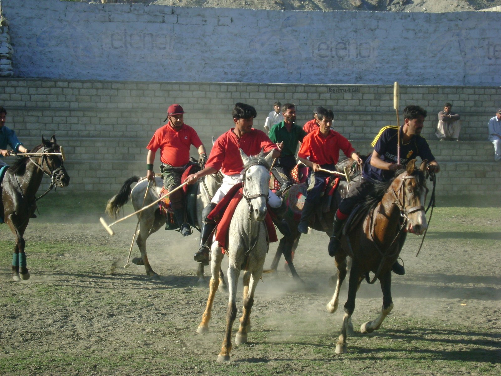 Polo players on horseback during a match in Gilgit.