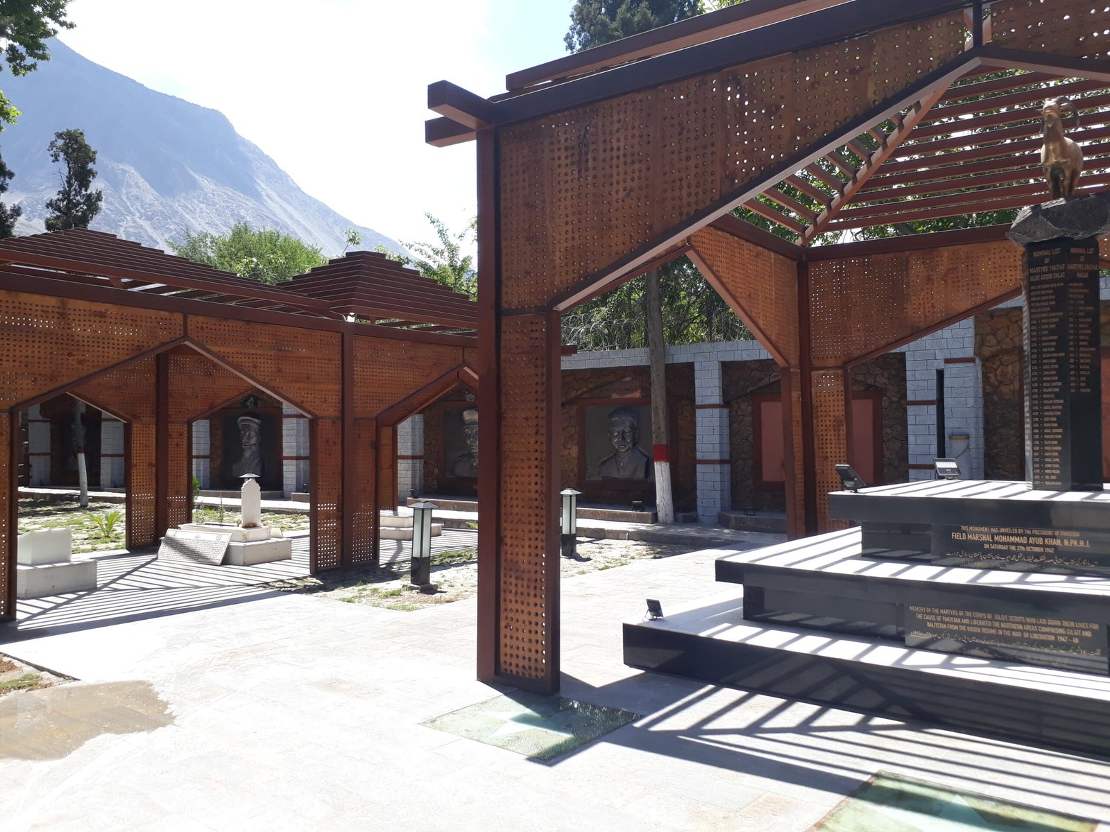 The Yadgar-e-Shohda memorial to the Gilgit Scouts martyrs of 1947-48, with portrait reliefs and a nominal list of martyrs.