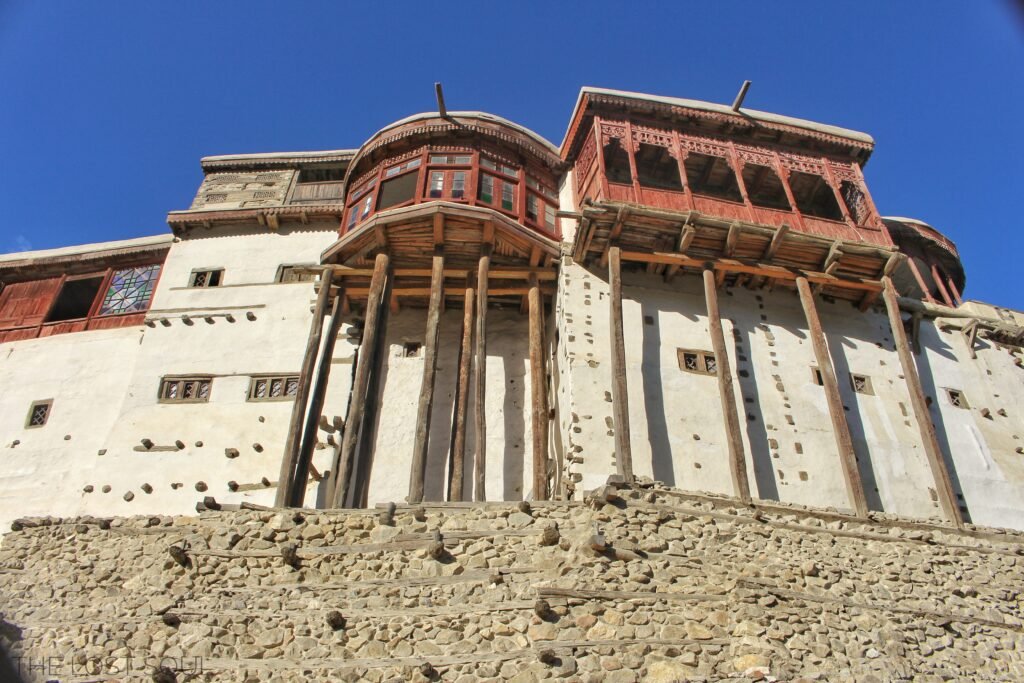 Baltit Fort, a stone fort with timber balconies, standing above Karimabad in Hunza