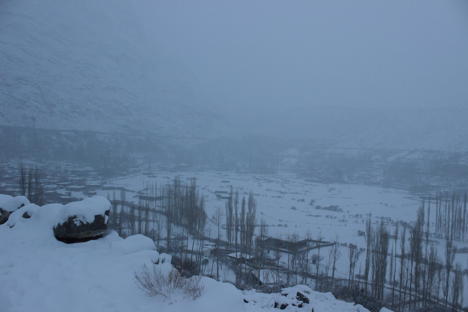 Snow-covered fields and village at Ghulkin, Gojal, in Hunza in winter