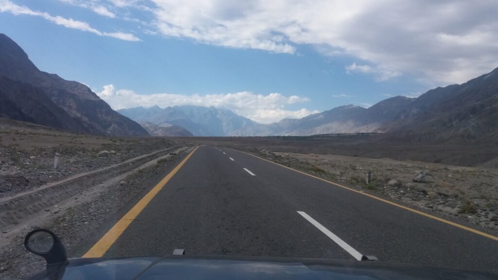 Paved road to Gilgit running through a dry mountain valley
