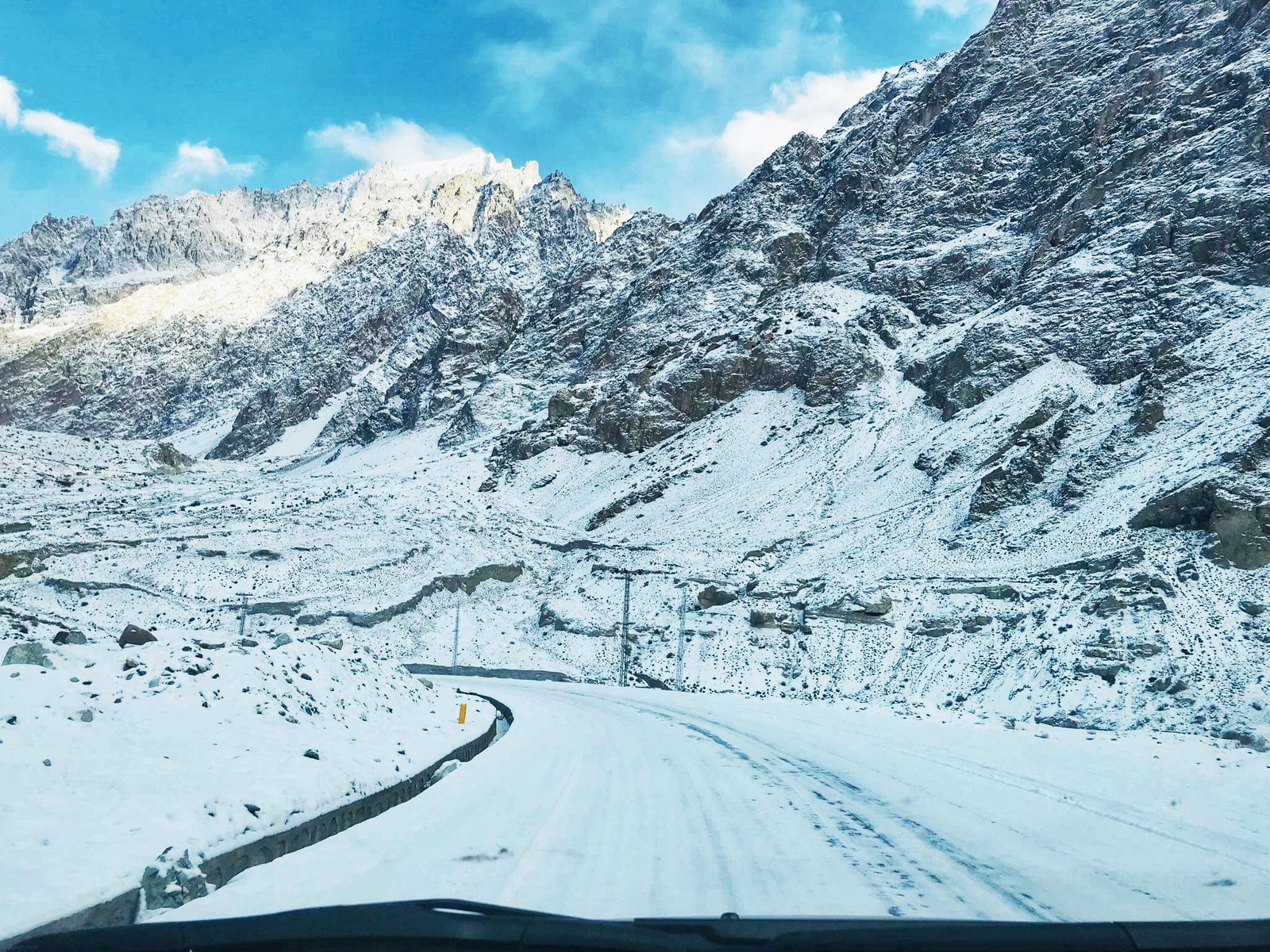 Snow-covered mountain road in Hunza Valley in winter