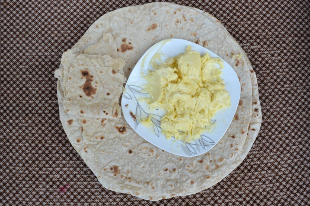 Flatbread served with a dish of butter, a traditional Hunza serving