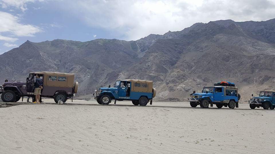 Expedition jeeps on the desert road from Skardu to Askole, the start of the K2 base camp trek