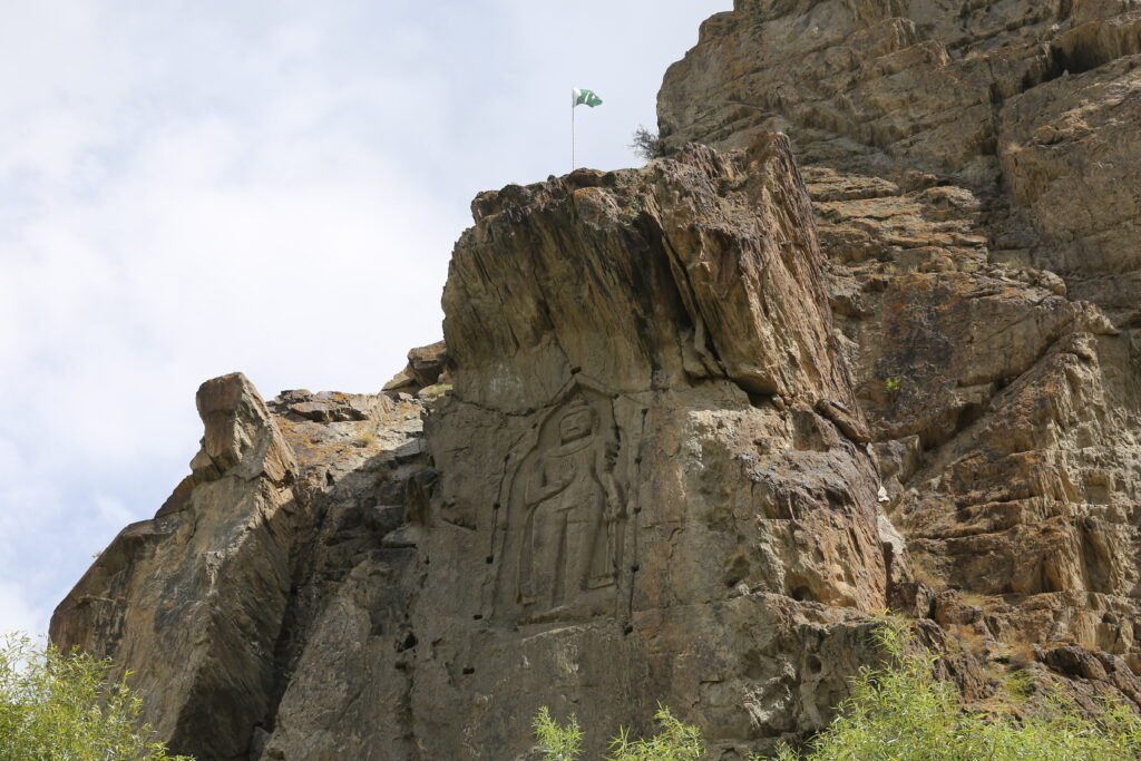 The standing Kargah Buddha carving in the cliff face near Gilgit