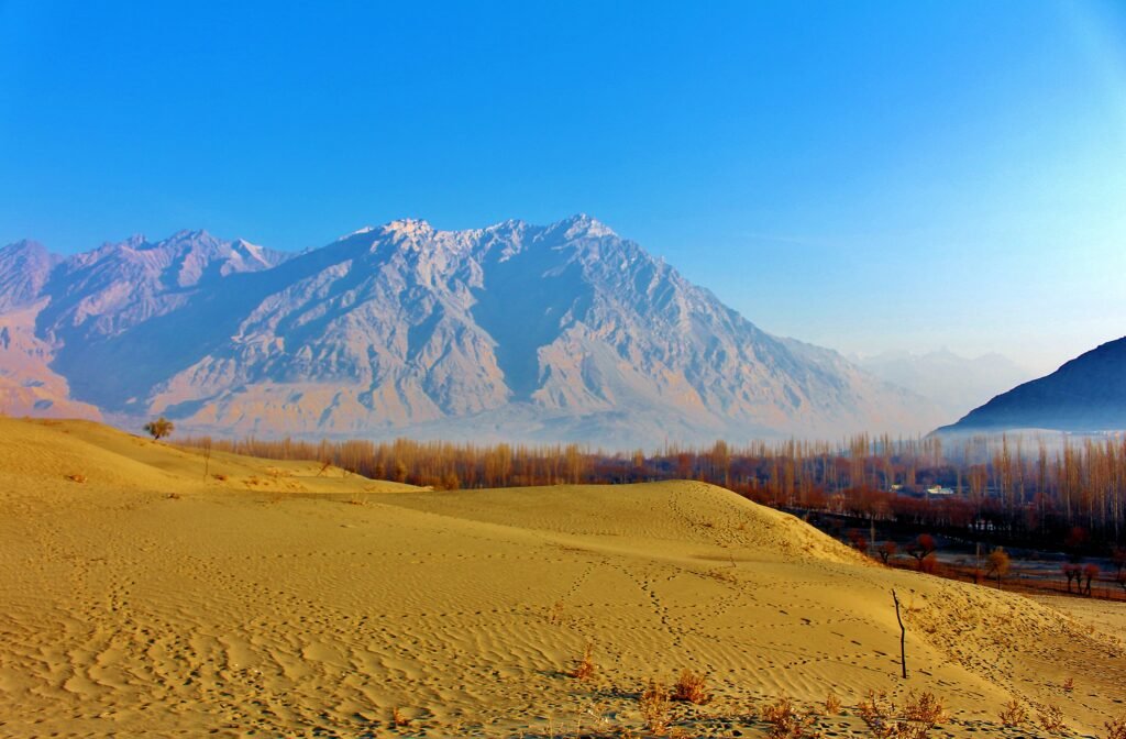 Sand dunes of the Katpana Cold Desert beneath mountains near Skardu