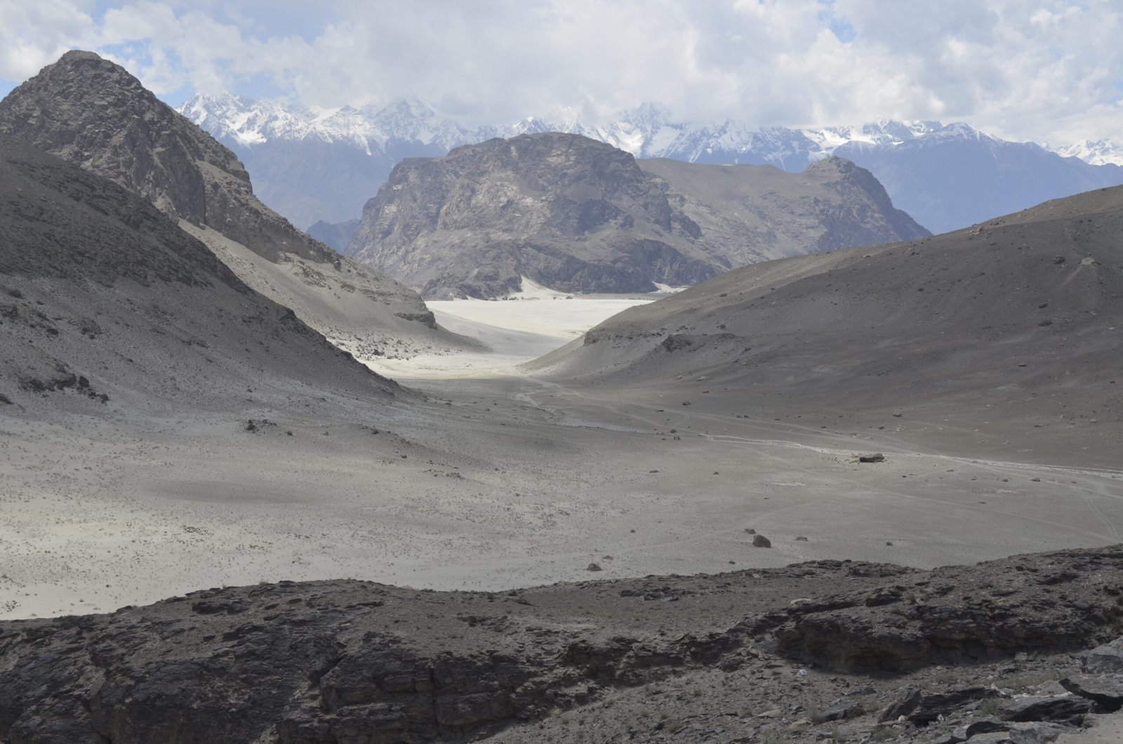 Sand dunes of the Katpana cold desert with snow peaks behind, Skardu