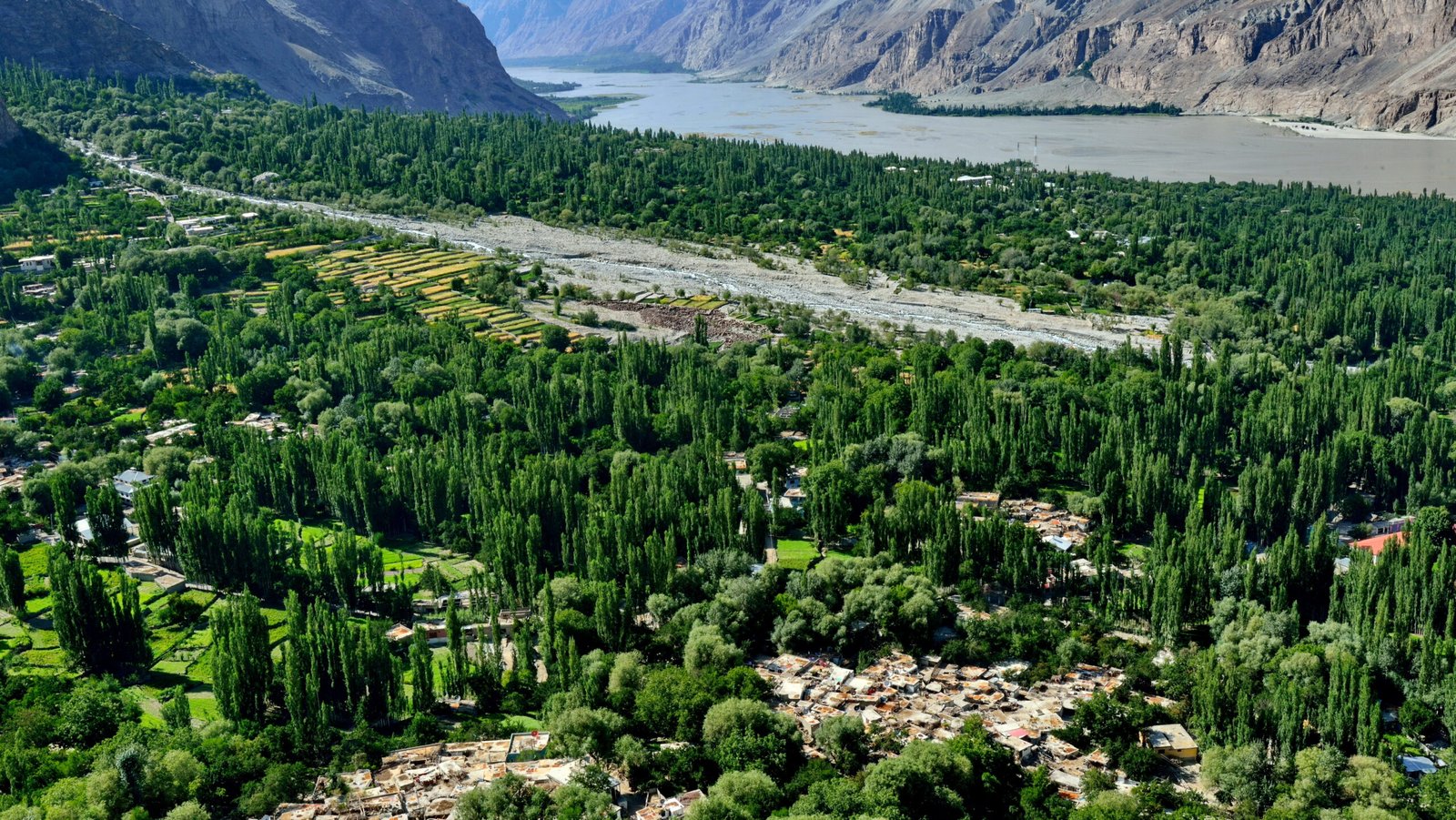 Khaplu town's green orchards and poplar groves beside the Shyok River
