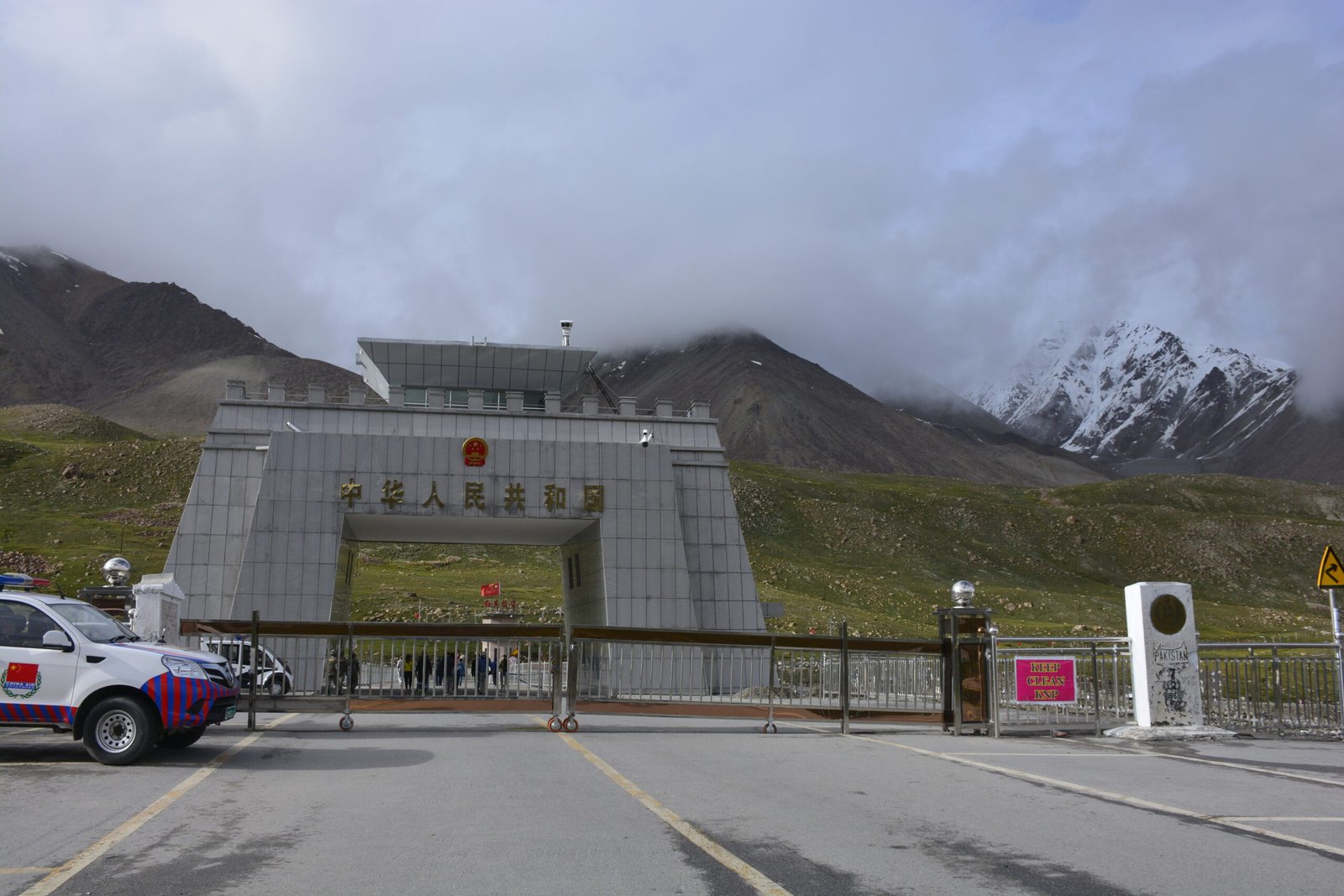 The Pakistan–China border gate at Khunjerab Pass beneath snow peaks