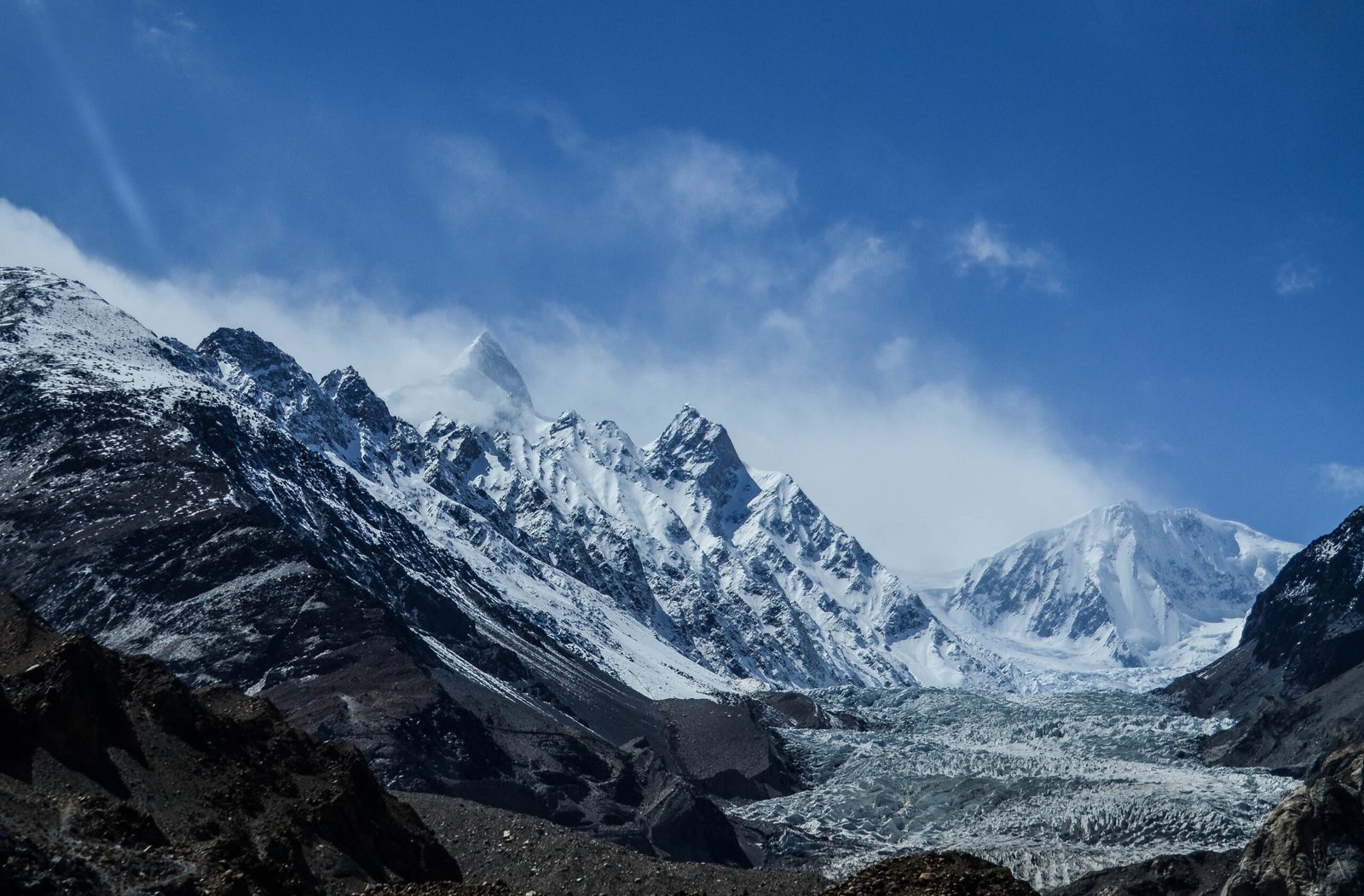 Crevassed ice at the snout of the Passu Glacier beneath the peaks of Gojal.