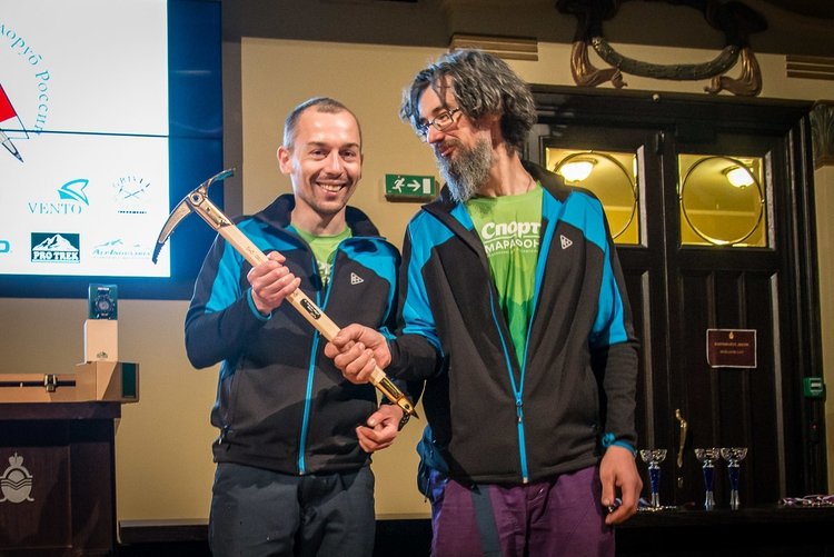 2017 Piolets d'Or winners Sergey Nilov and Dmitry Golovchenko with their golden ice axe