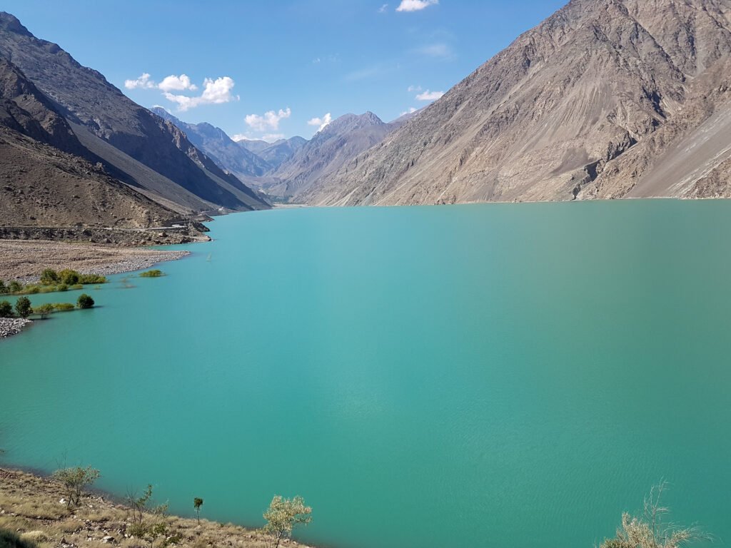 Turquoise water of Satpara Lake between mountains near Skardu