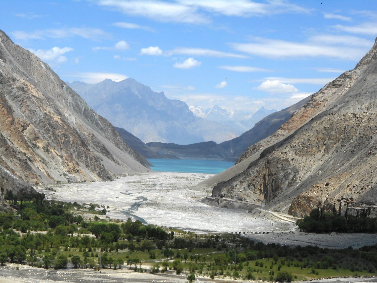 Turquoise Satpara Lake between barren mountains near Skardu